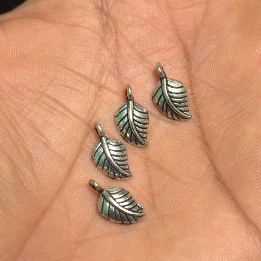 German Silver Leaf Charms 11mm - Silver / German Silver / 10 Pcs [ Rs 7.5 / Piece ]