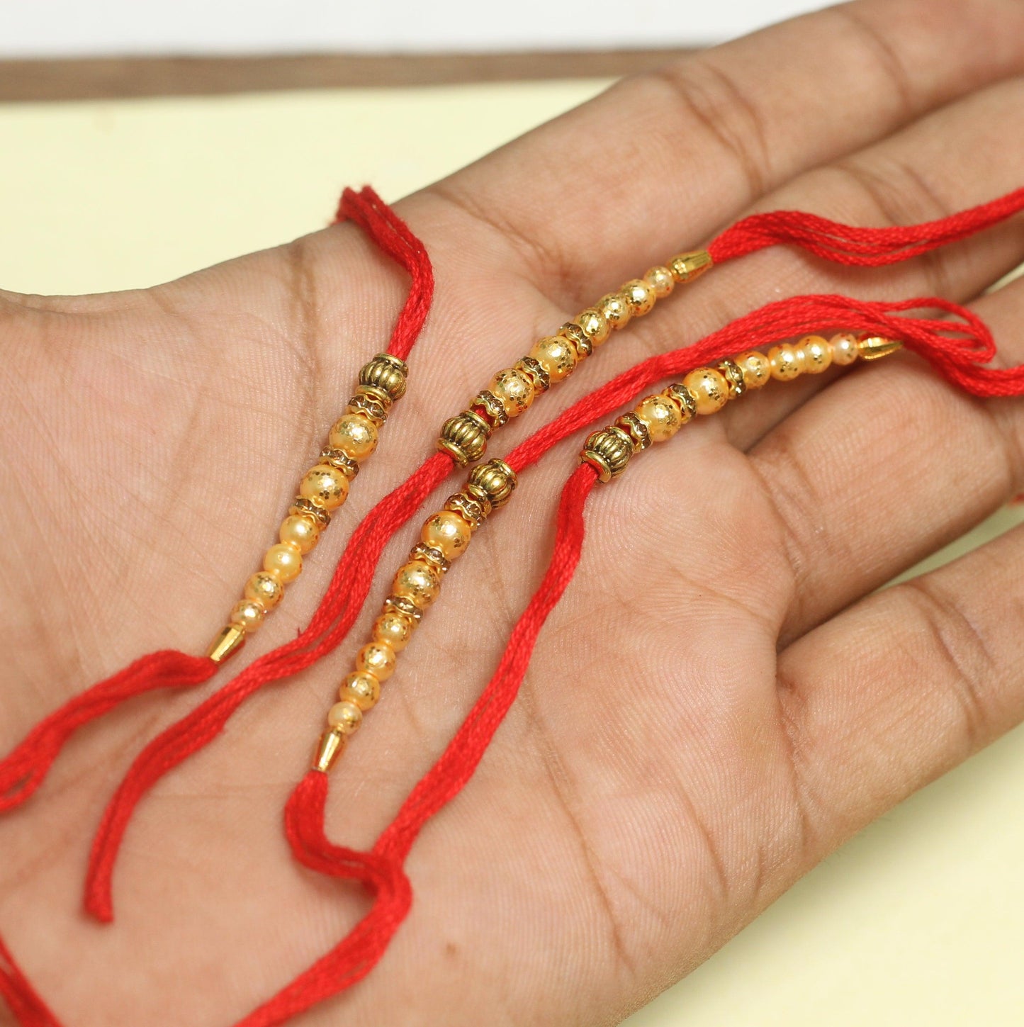 24 Pcs, Golden Beaded Rakhi Thread - 1 Packet